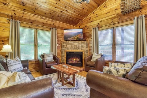 Comfy leather living room swivel chairs with sleeper sofa and loveseat.