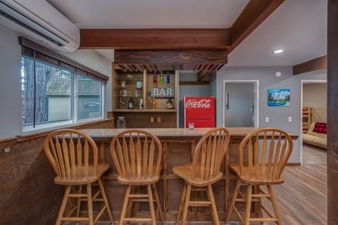 Bar located in the game room- with sink and fridge.