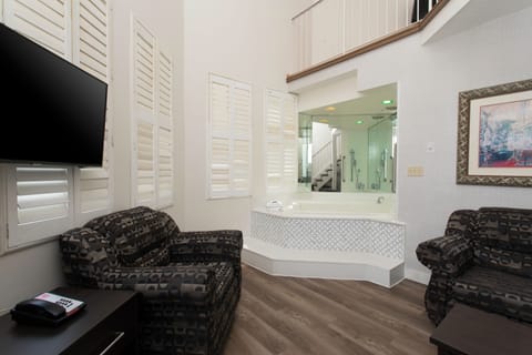 Two-floor Castle Suite, 1 Queen Bed, Jetted Tub (Non-wheelchair Accessible) | Blackout drapes, iron/ironing board, free WiFi, bed sheets