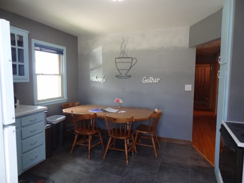 Kitchen with Keurig and regular coffee pot.