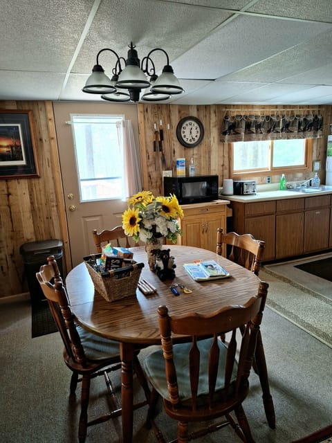 Diningroom. Paper plates, napkins and solo cups included. Extra chairs for table