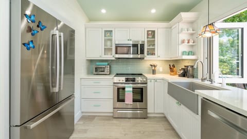 The fully renovated kitchen has all new stainless steel appliances...