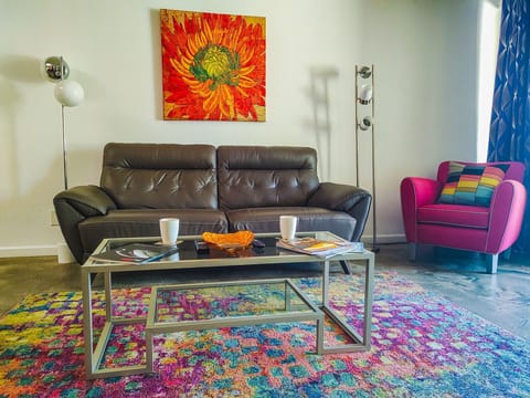 Colorful, comfy and spacious living area.