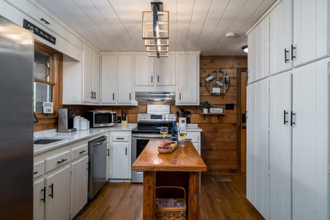 Kitchen with center island for preparing and serving food. 