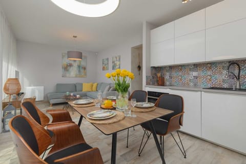 Kitchenette with dining area and lounge room.