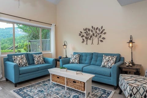 Main seating area with natural lighting and soft shades of blue