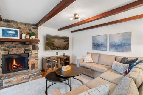 Settle in after a day Up North—cozy nights by the fireplace with room for everyone to gather.
