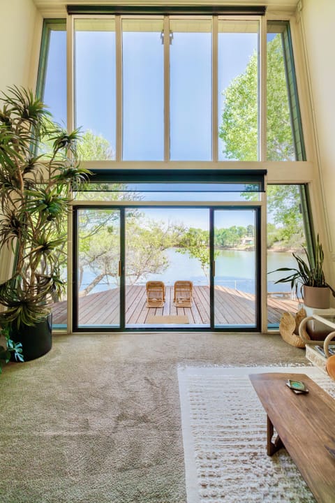Cozy living room with panoramic pond views.