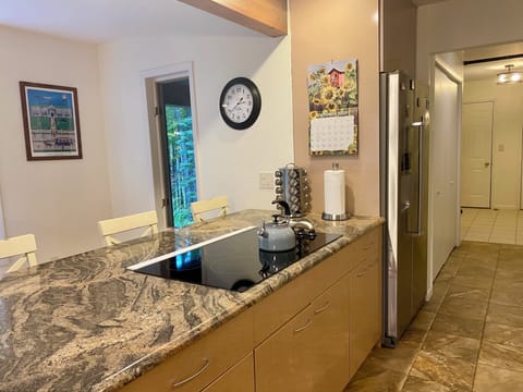 Kitchen hall w/ double door pantry leads to laundry/mud room & access to garage