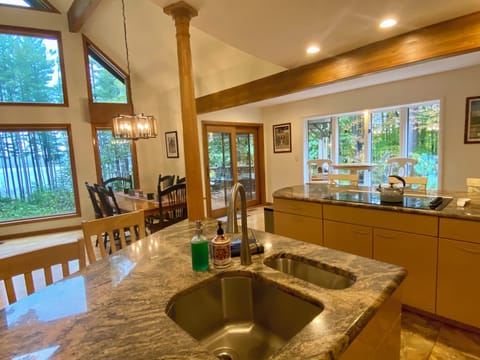 Open kitchen area with bar seating, great for socializing while you meal prep.