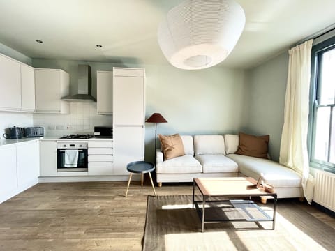 Open plan kitchen/living area with smart TV and double sofa bed (1)