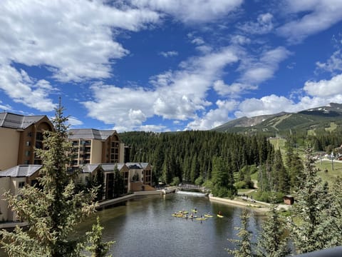 View from the Condo.  Paddle Boarders on the Maggie with Ski Area Views