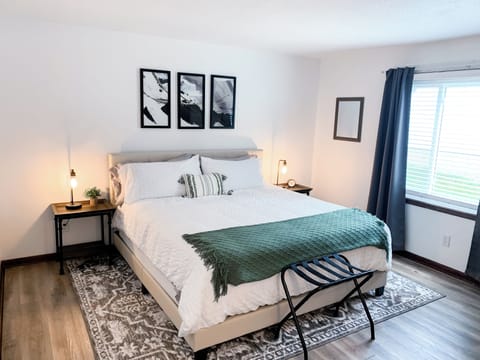 Bright & Airy King Bedroom featuring Plush Bedding and Blackout Curtains