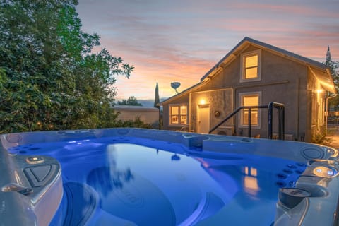 Farmhouse viewed from the swim spa at dusk. 