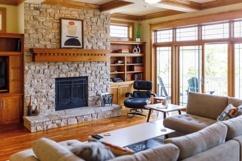 Welcome to Cottage Row Retreat in Fish Creek. The living room is full of gorgeous interior craftsmanship