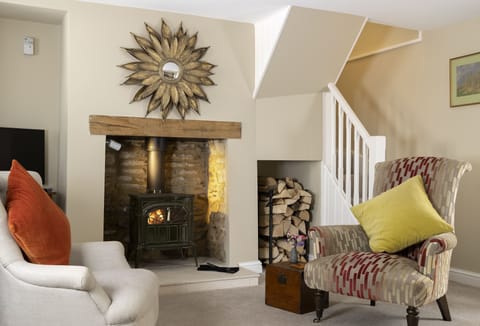 Ground floor:  Settle in by the fireside after a day out exploring the local area