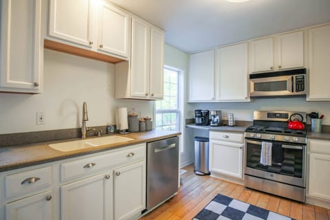 The kitchen also features stainless steel appliances.