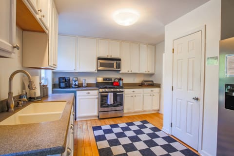 The Heron Hideaway kitchen features ample cabinets & counter space and a pantry.