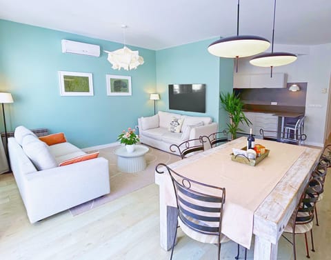 Living room with two sosfas and a large dining table