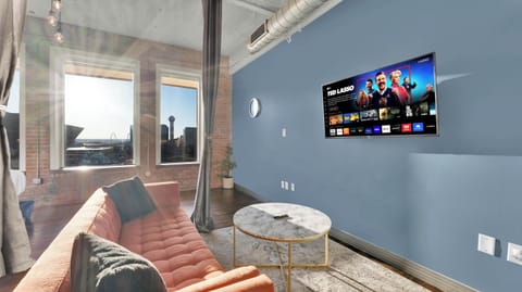 Stunning views from large windows, modern decor, and lounge-ready seating await you!