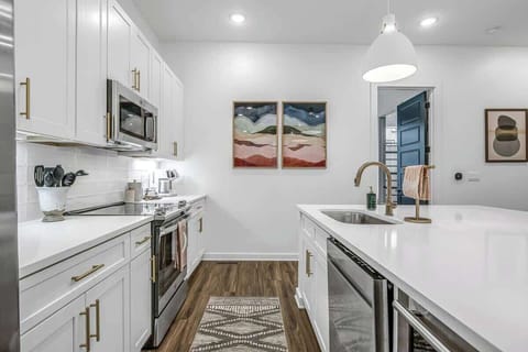 Level 2 kitchen equipped with stainless steel appliances and everything for culinary adventures.