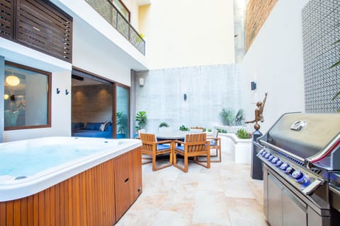 Large Private Patio with Jacuzzi, BBQ, Dining, and Lounging Areas