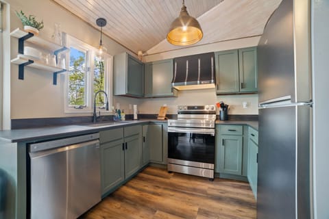 Completely stocked- Pots,  flatwear, dishes, towels, dishwasher soap, spices