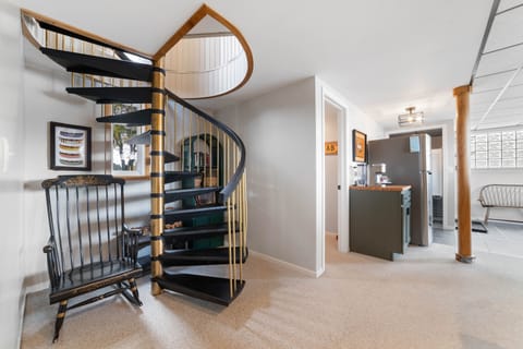 Spiral staircase between main floor and  walkout basement