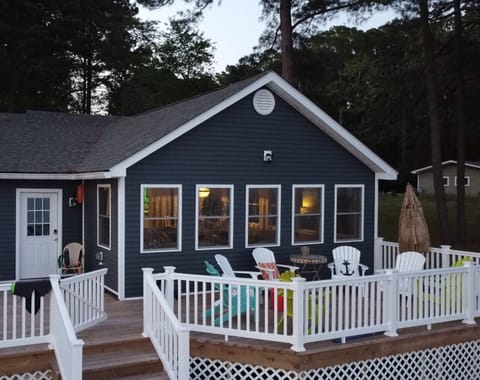 Back Deck overlooking the water.  Panoramic views of the sunrise and sunset.  