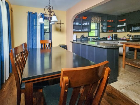 Long table accommodates all of the family. Perfect for large meal or games.