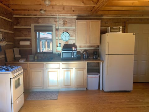 Fully stocked kitchen: utensils, cookware, dishes, wine glasses, spices, oils...