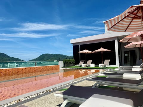 Outdoor pool, open 8:00 AM to 8:00 PM, pool umbrellas, sun loungers