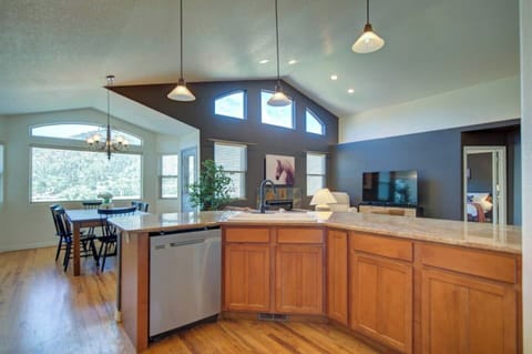 Chefs kitchen opens up to large living/dining area