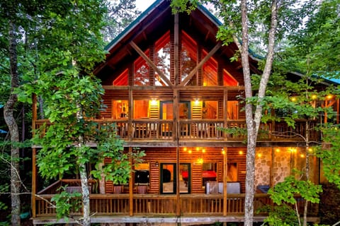 Charming Cabin Retreat: Nestled among the trees, three layers of decks to watch the distant mountains, and listen to the creek below. A+ location off of Wears Valley Road near the Parkway. check out the amazing bunk room, theater, arcade, & chef's kitchen