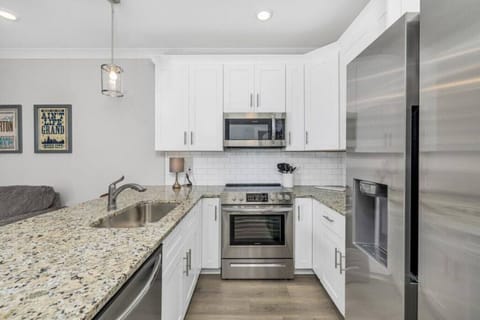 Stocked kitchen with pots and pans,