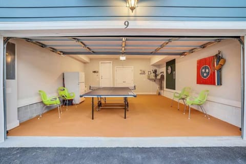 Garage has a ping pong table but will still accommodate one car. Additional parking nearby.