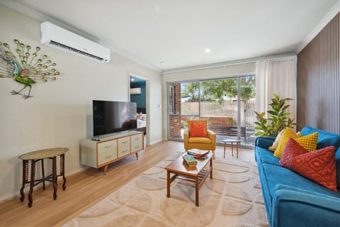 Relax in the comfortable living area with Smart TV for streaming and downtime