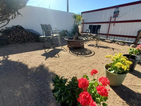 Enjoy a warm fire while sitting around the firepit.