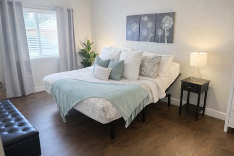 Clean and modern master bedroom with comfy king sized bed 