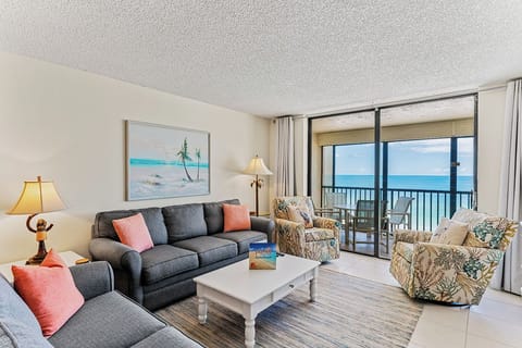 Relax in your bright living room with stunning ocean views from your private balcony.