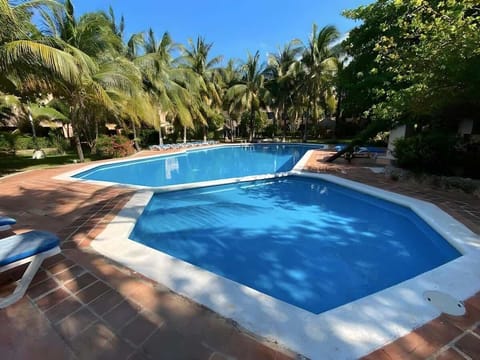Shared pool with tropical garden