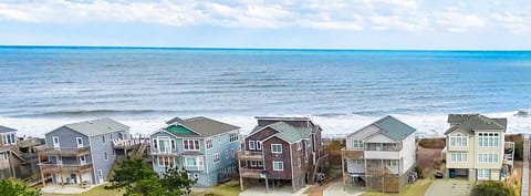The beach access with a wooden walkway is located directly across the street!