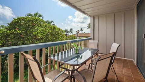 Sip your morning coffee on your private balcony, surrounded by tropical palms and gentle island breezes—a perfect spot to unwind and soak in the serene atmosphere.