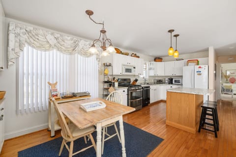 Dine in the Eat-in Kitchen or in the Sunroom.