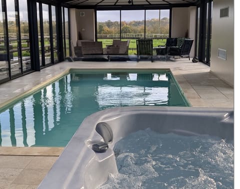 Indoor pool, a heated pool, sun loungers