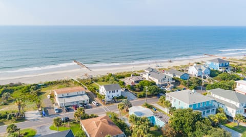 Soak up the views and chill vibes of Folly Beach. (blue house left)