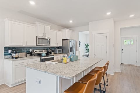 The pantry closet provides additional space to store food items and snacks.