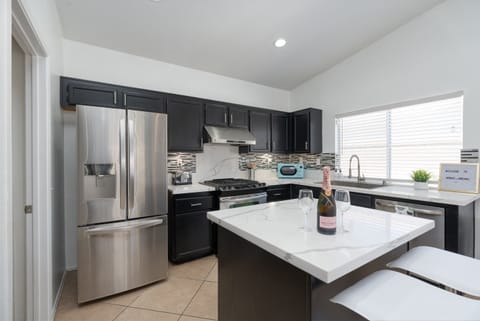 Stainless steel appliances refrigerator, oven, stove top, hood, retro microwave