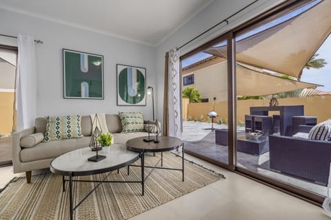 Snug on this sofa in the living room. You can view the outside thru a large sliding door. The curtains add privacy and intimacy during night time.