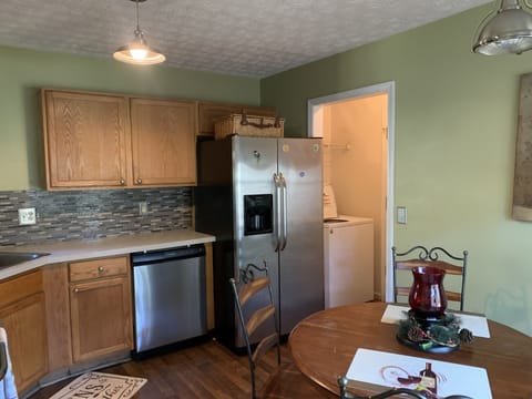 Kitchen brings family together/laundry room next door